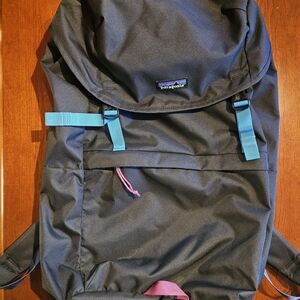 Patagonia Black Backpack with Teal and Pink Details
